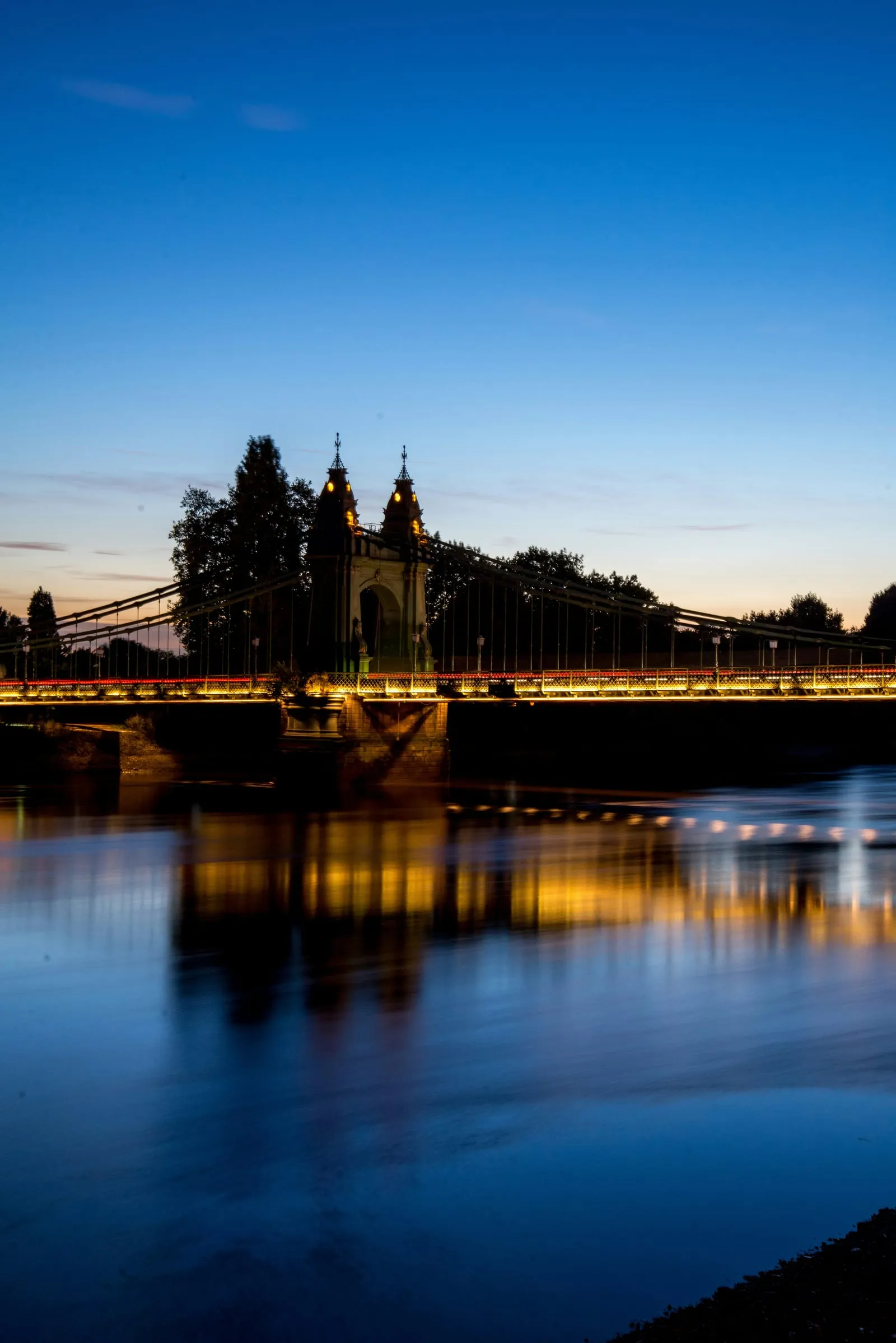 Hammersmith Bridge over the Thames at dusk